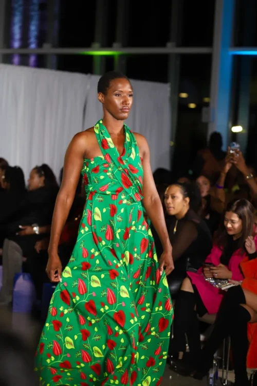 Asiha Grigsby floats down the runway in a custom dress. Credit: Photo courtesy of Darrell Stoney Sr.