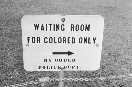 A sign in Jackson, Miss., in May 1961. The contract clause deleted from federal regulations last month dated back to the mid-1960s and specifically said entities doing business with the government should not have segregated waiting rooms, drinking fountains or transportation (William Lovelace/Hulton Archive/Getty Images)