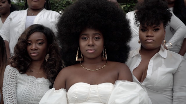 Black women in white outfits