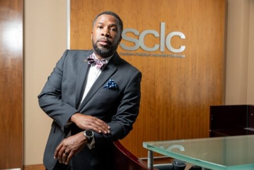 Demark Liggins, a Black man, in a suit