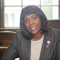 Congresswoman Terri Sewell sitting and smiling at the camera