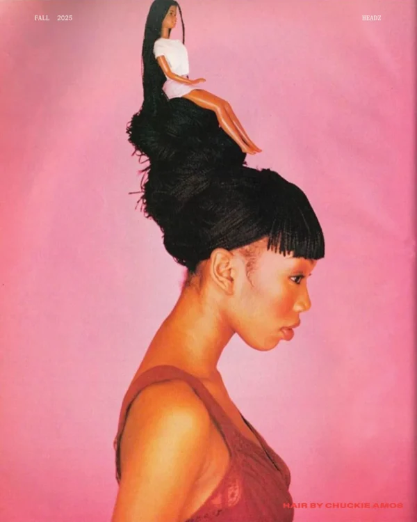 Brandy with a hairstyle topped by a Black Barbie