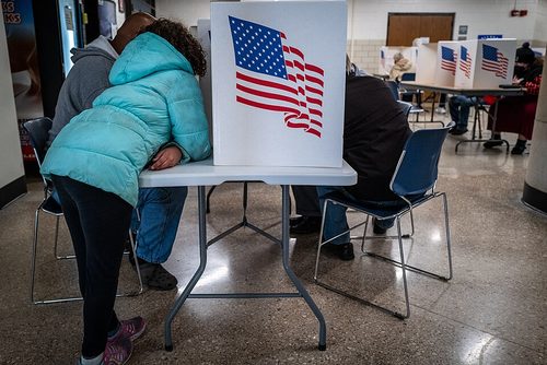 Voters in a polling booth. Black churches in Pennsylvania have started mobilizations to impact voter registration and voting access. (Phil Roeder, Wikimedia)